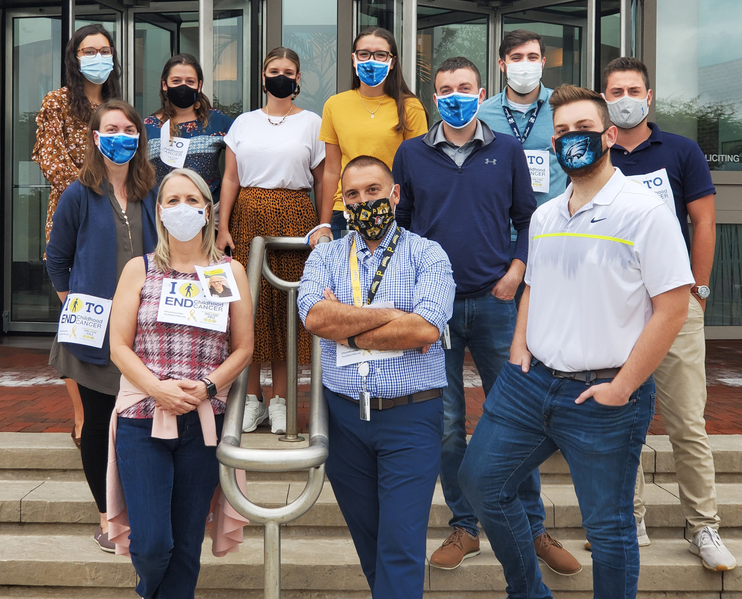 TRIOSE employees wearing wearing masks, attending medical charity event